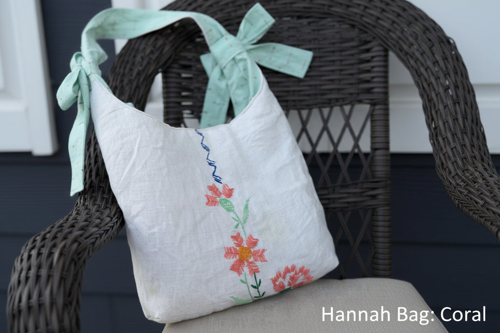 Handmade bag with floral embroidery on a wicker chair