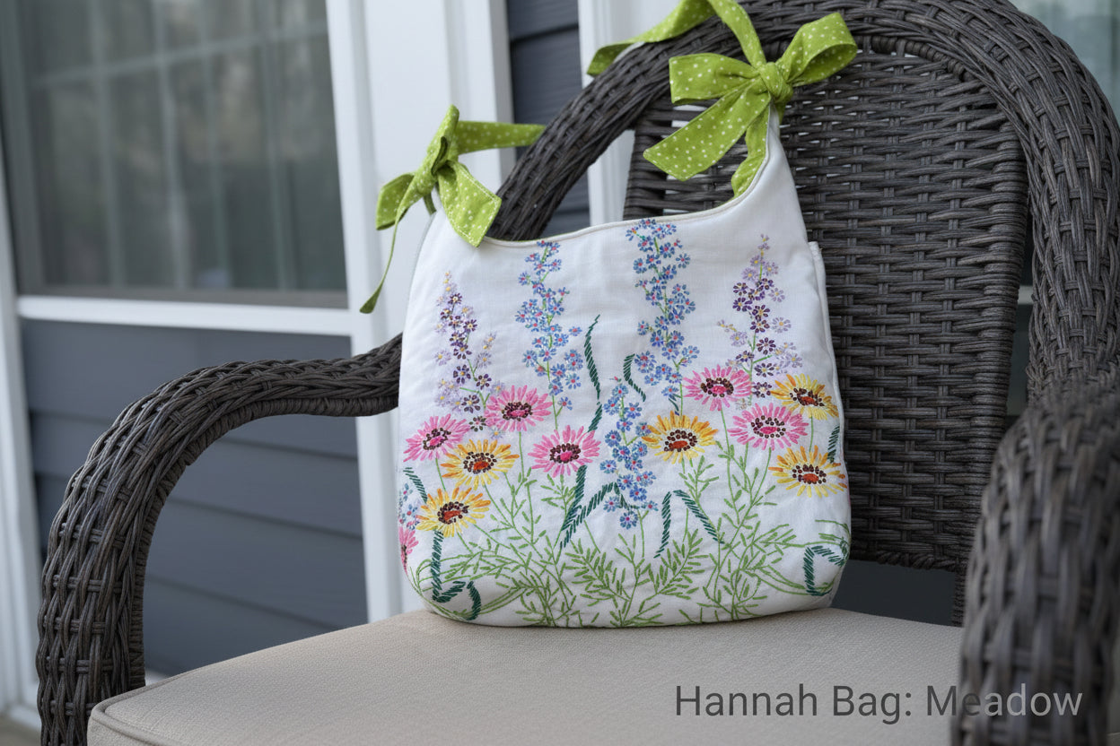 Handbag with floral embroidery and green ribbon on a blurred background