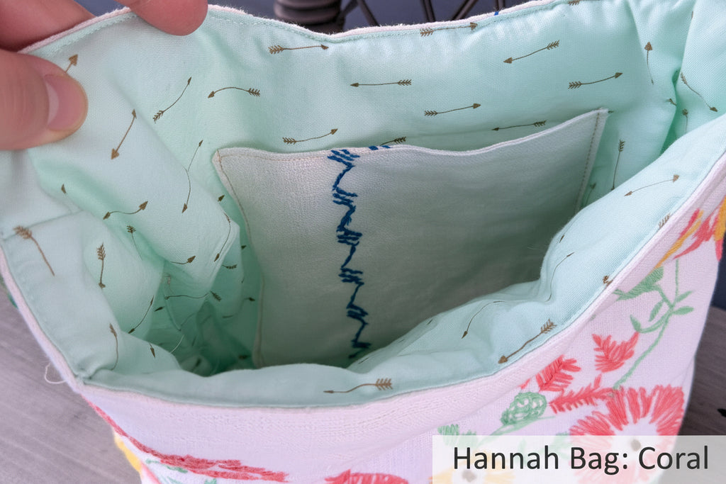 Close-up of a fabric item with embroidered details and floral patterns.